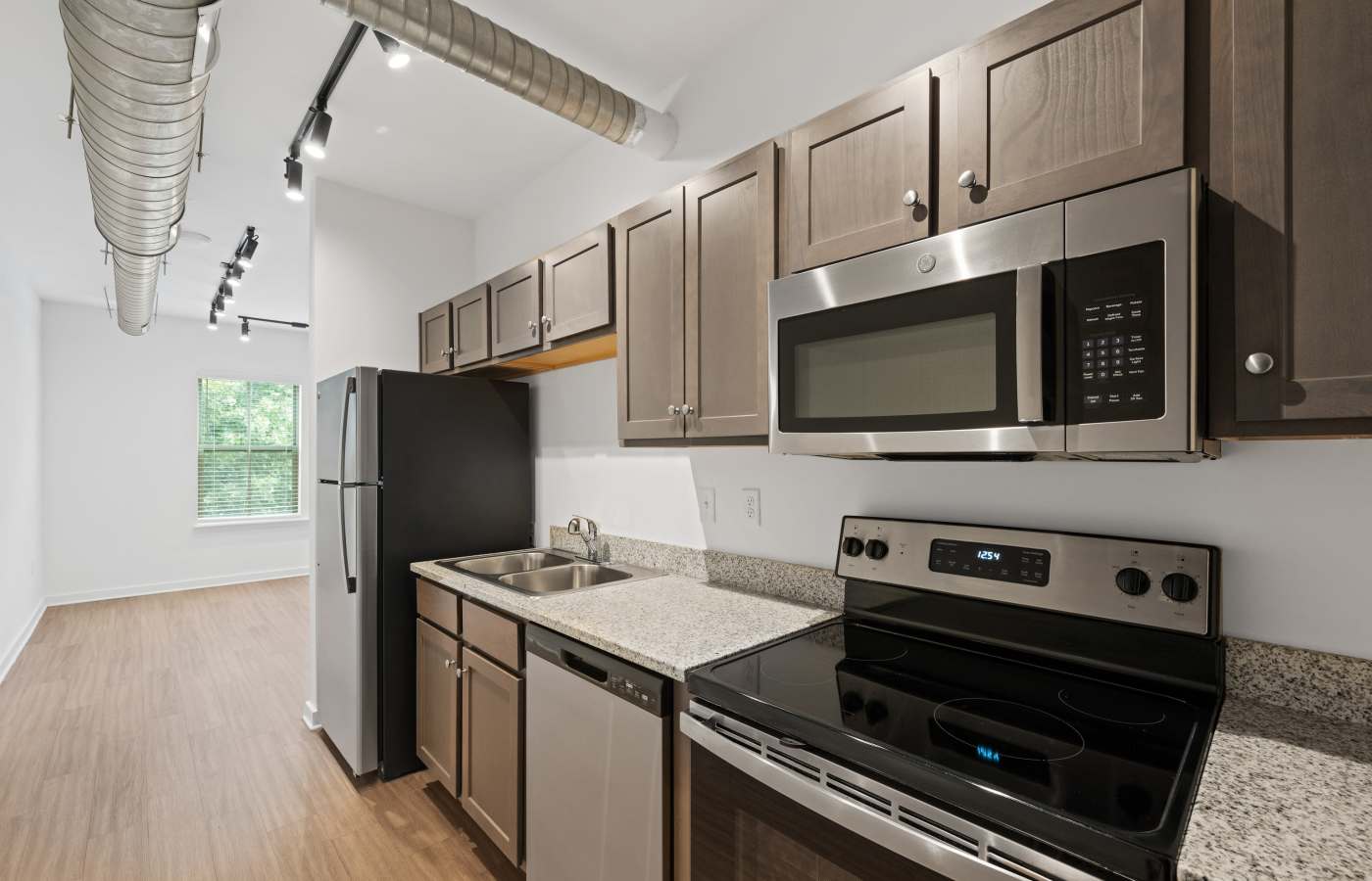 Modern apartment kitchen with stainless steel appliances