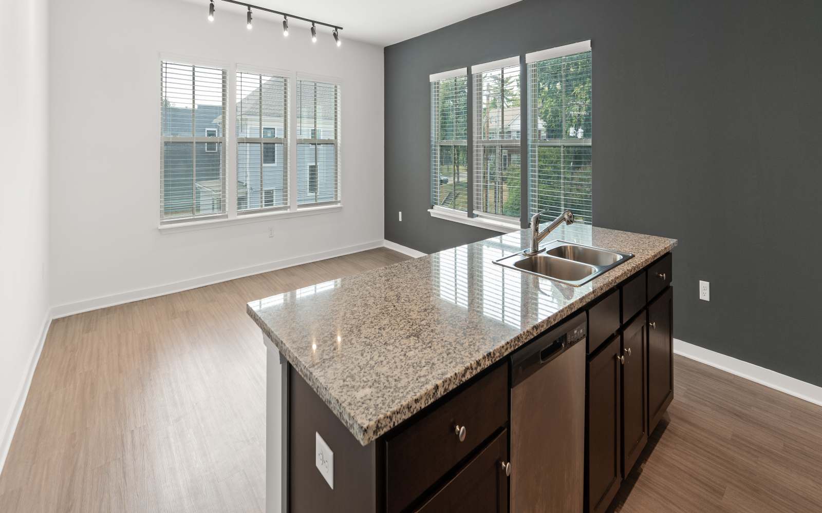 Light-filled apartment interior with quartz kitchen island